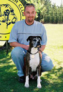 Erik De Boer with his first boxer Tara receiving her veteran's medal.